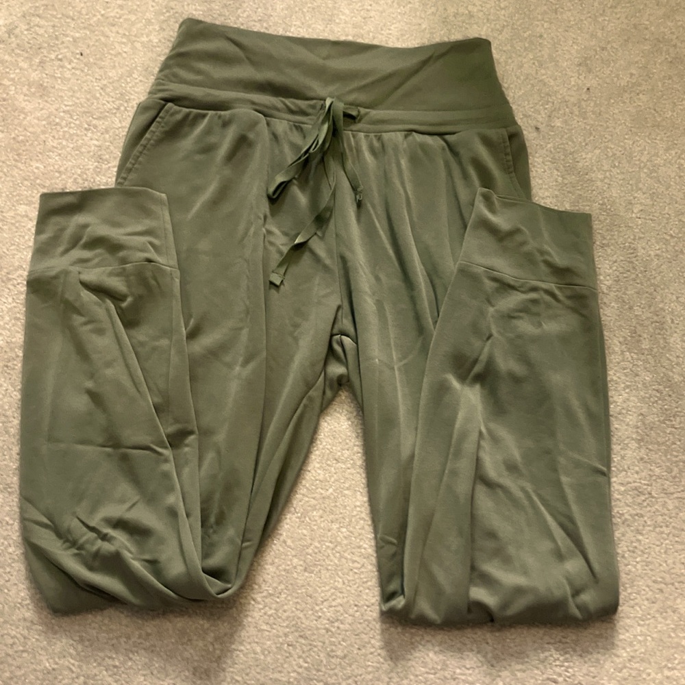 Fabletics green joggers with drawstring and pockets, lightweight thin material